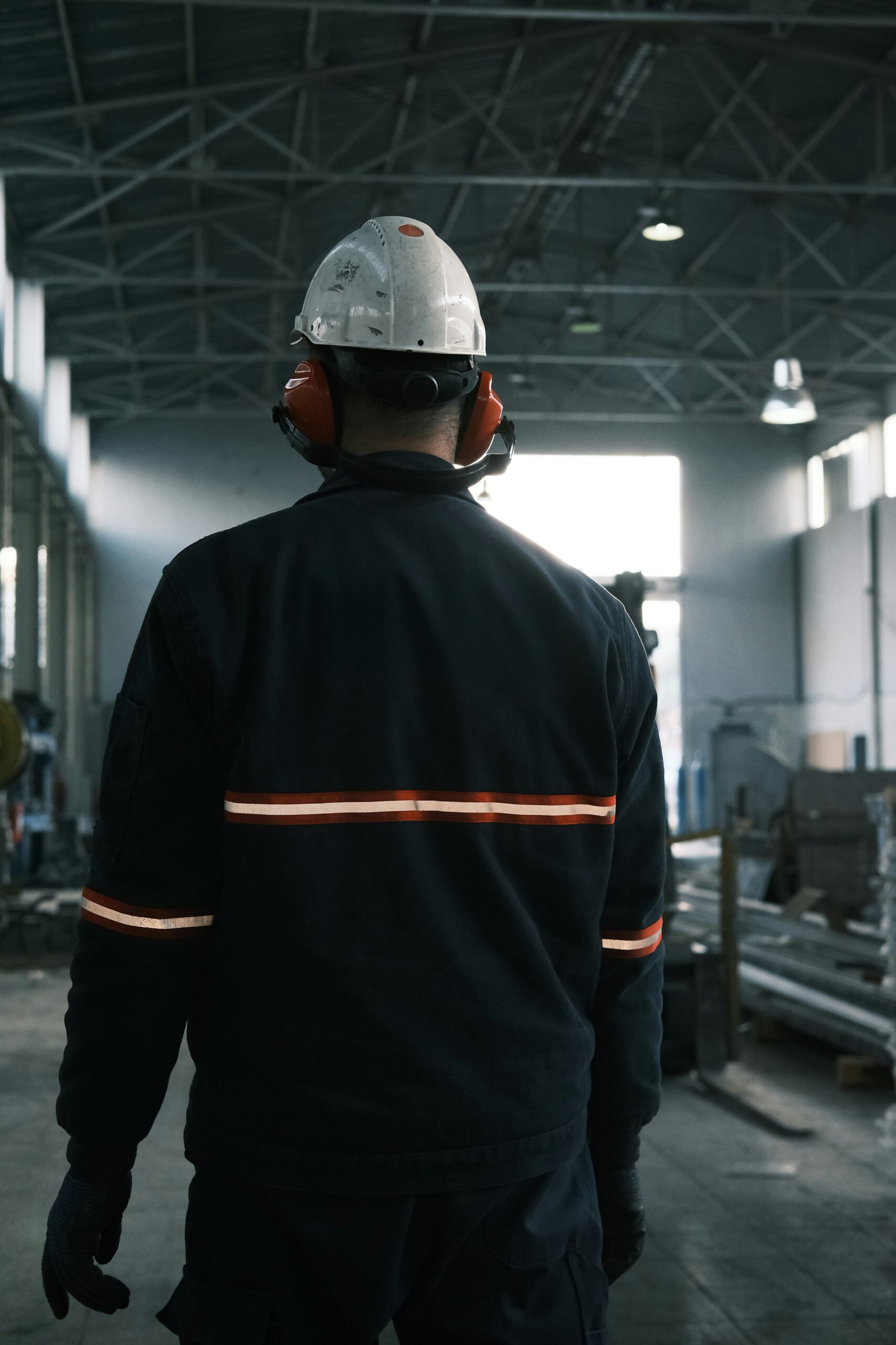 worker operating in an industrial confined environment with Grace Industries personal safety device